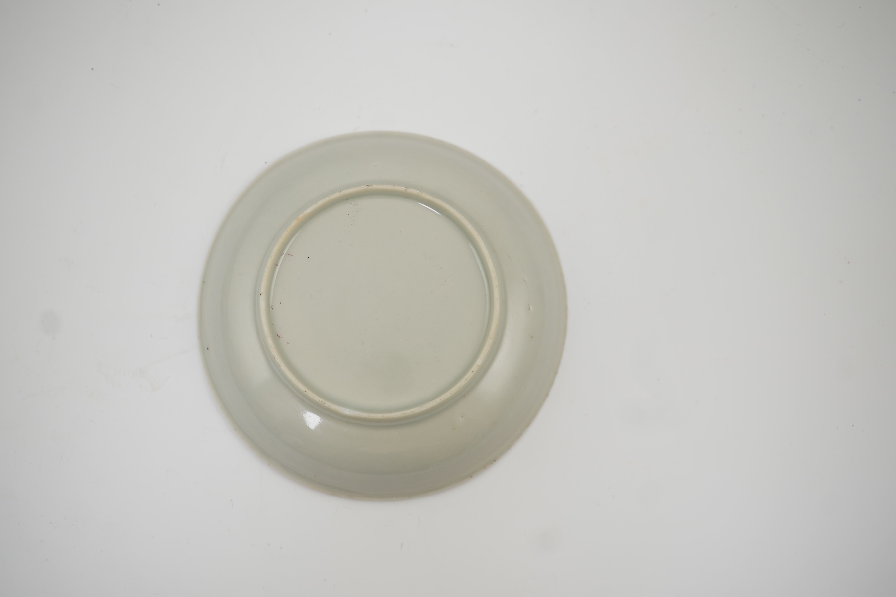 A Chinese semi-eggshell porcelain saucer and a similar tea bowl, Yongzheng period